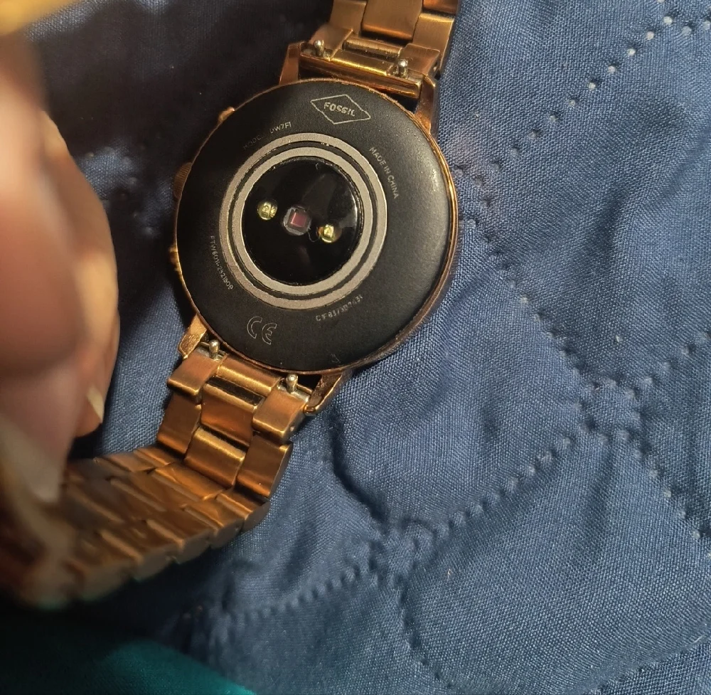 Gold Smartwatch with Black Charging Cable